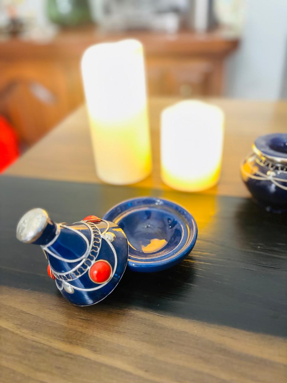 Atlas Maple Ember Mini Tajine showing a small ceramic cooking dish with decorative patterns on a wooden surface.