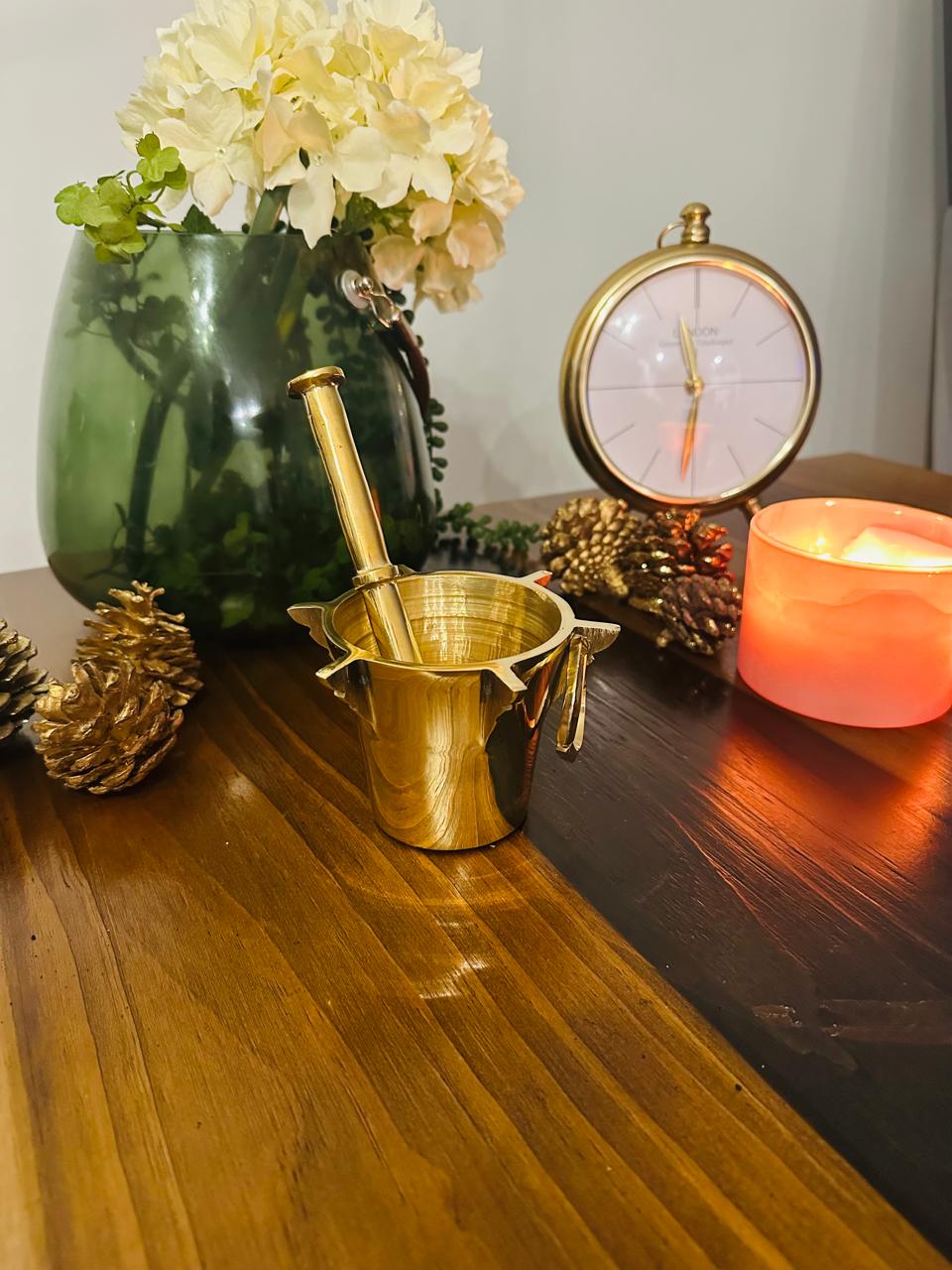 Heritage Brass Mortar and Pestle by Atlas Maple, showcasing a polished brass mortar with pestle for grinding spices.