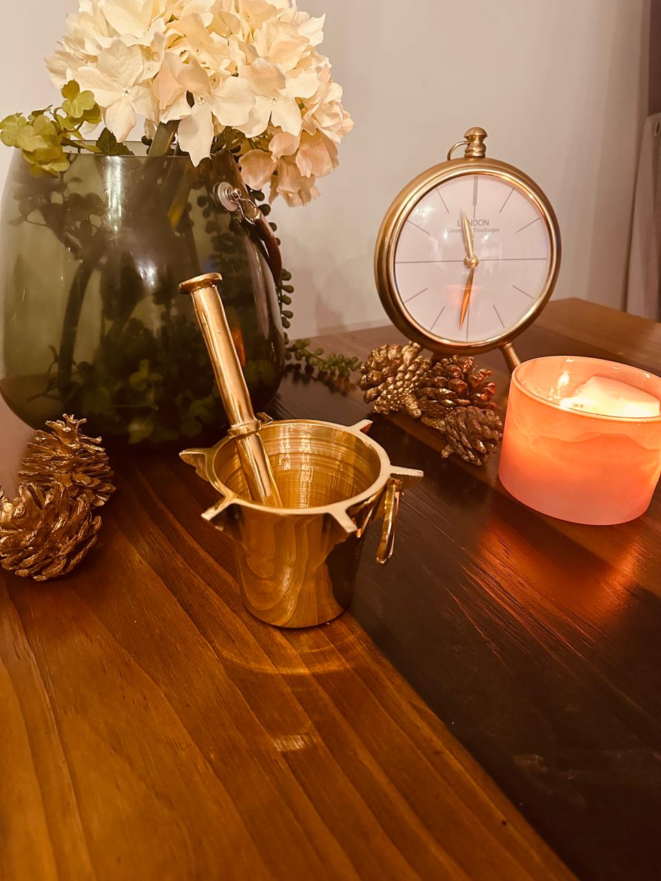 Atlas Maple Heritage Brass Mortar and Pestle set with a polished brass finish and sturdy design for grinding herbs and spices.