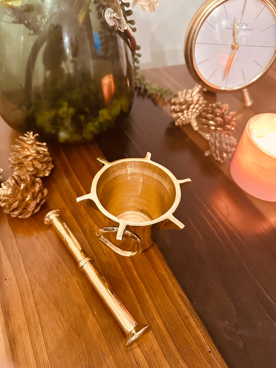 Atlas Maple Heritage Brass Mortar and Pestle set, with a sturdy brass mortar and pestle for grinding herbs and spices.