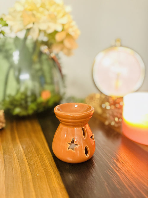 Atlas Maple Ember Glow Diffuser burner with a sleek ceramic design and warm amber glow for aromatherapy diffusion.