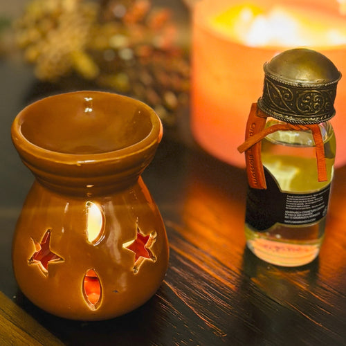 Atlas Maple Ember Glow Diffuser oil burner with ceramic design and glowing accents, perfect for aromatherapy and home decor.