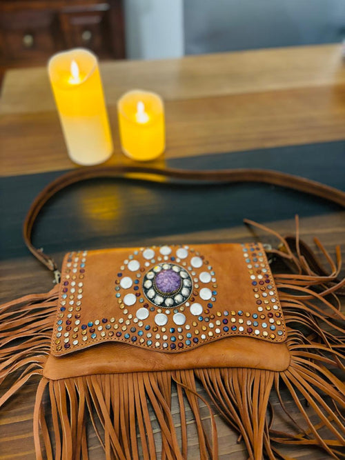Atlas Maple Nomad Fringe Crossbody bag with leather strap and decorative fringe, displayed on a neutral background.