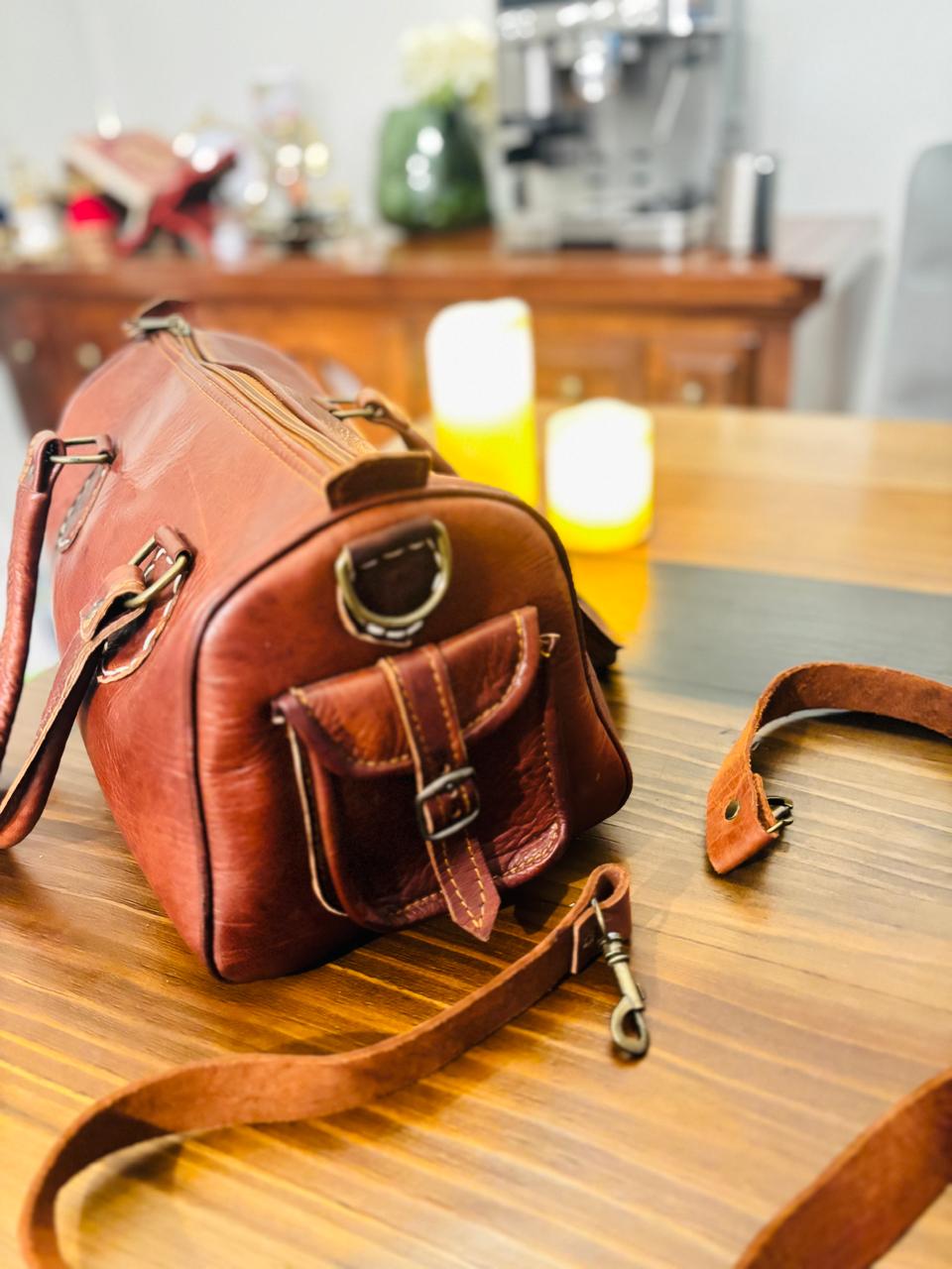 Atlas Maple Nomad Leather Weekender bag with sturdy handles and spacious interior, ideal for travel and weekend trips.