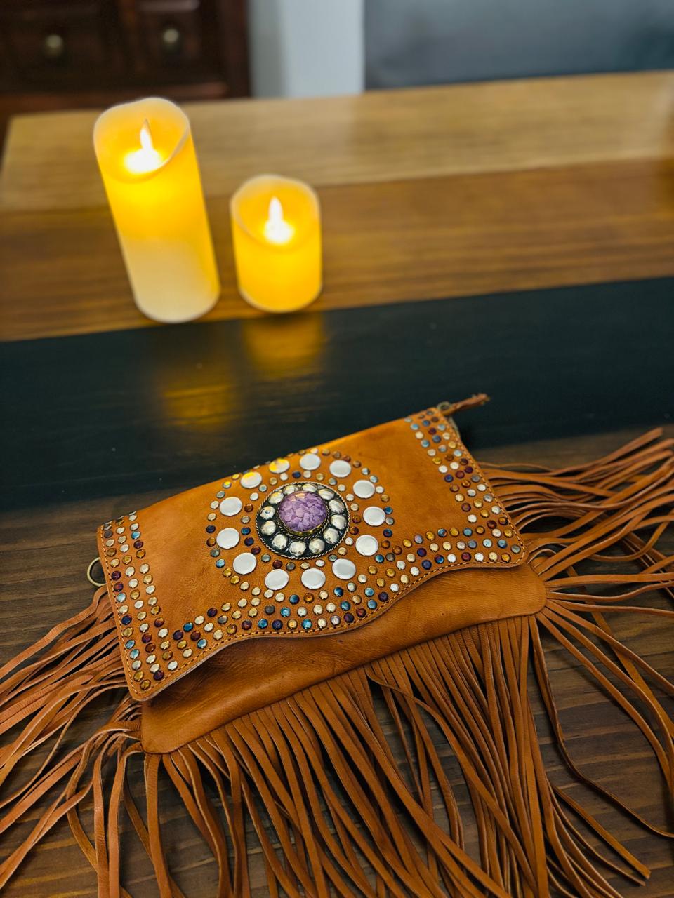 Atlas Maple Nomad Fringe Crossbody bag with leather strap and boho-style fringe detailing on soft, durable fabric.