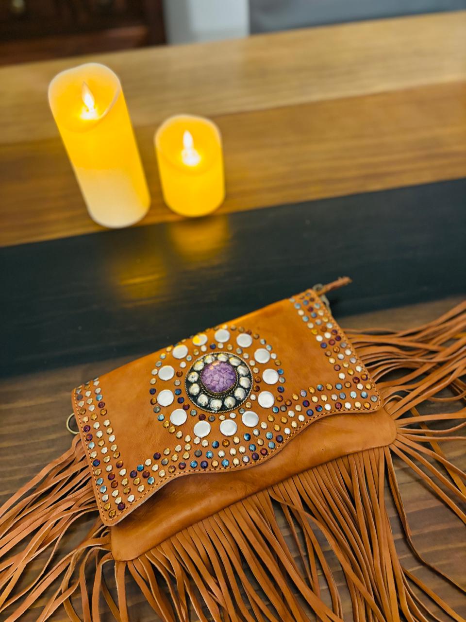 Atlas Maple Nomad Fringe Crossbody bag with leather strap and tassel details, showcasing boho-style design and textured craftsmanship.