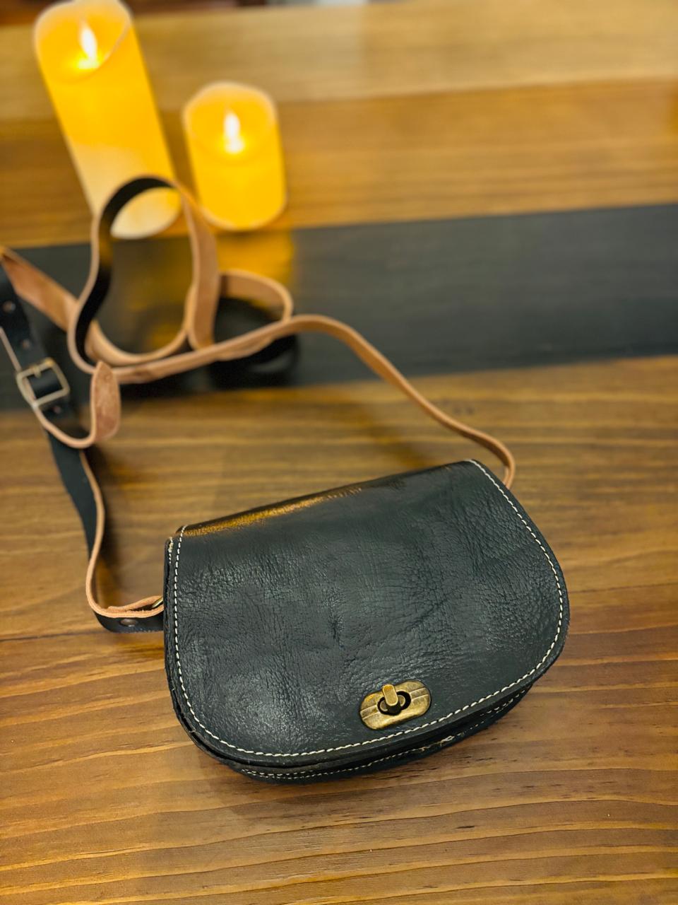 Atlas Maple Heritage Noir Crossbody bag with black leather and adjustable strap, shown on a neutral background.