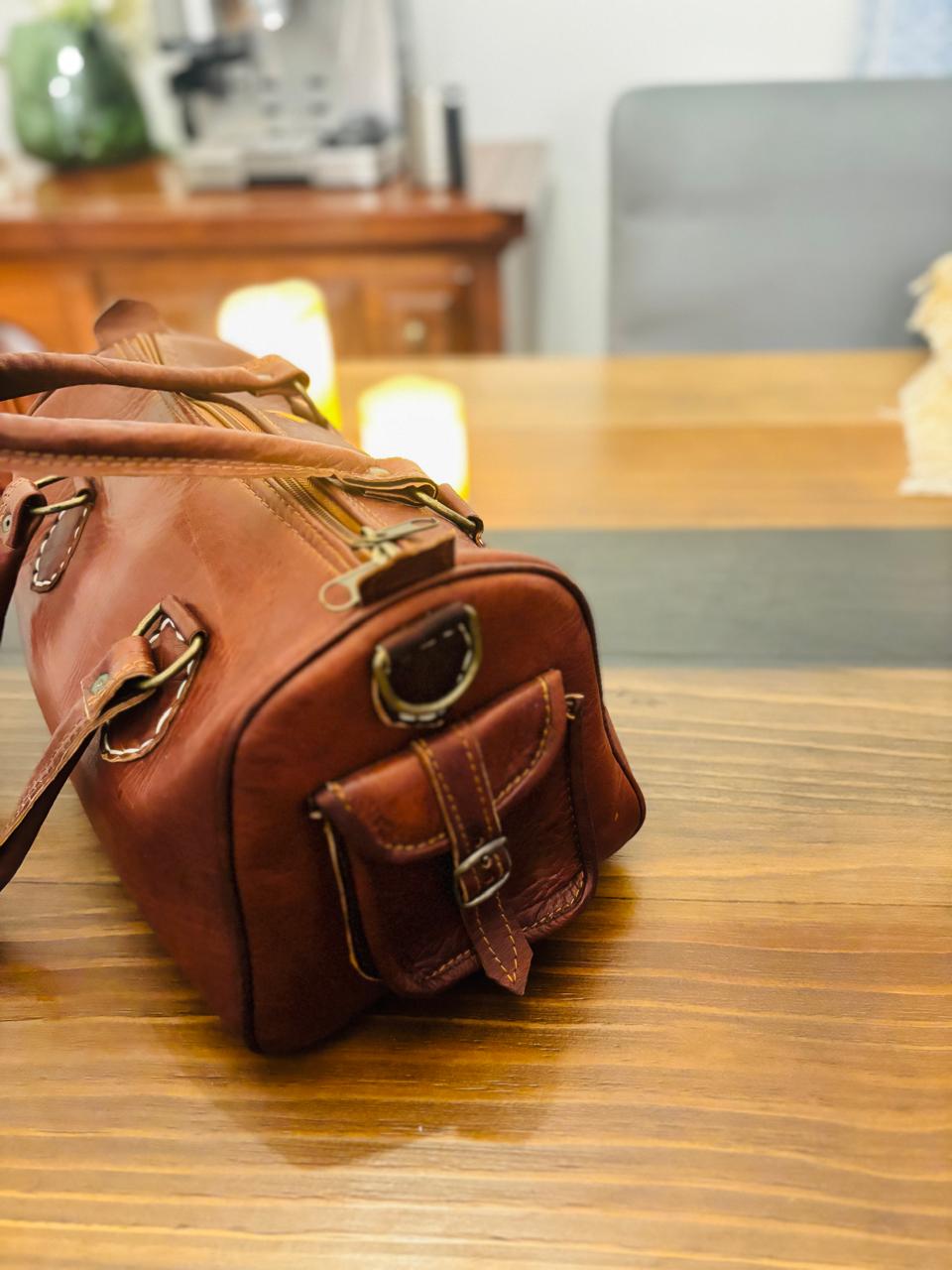 Atlas Maple Nomad Leather Weekender bag showing durable leather exterior and spacious interior for travel essentials.